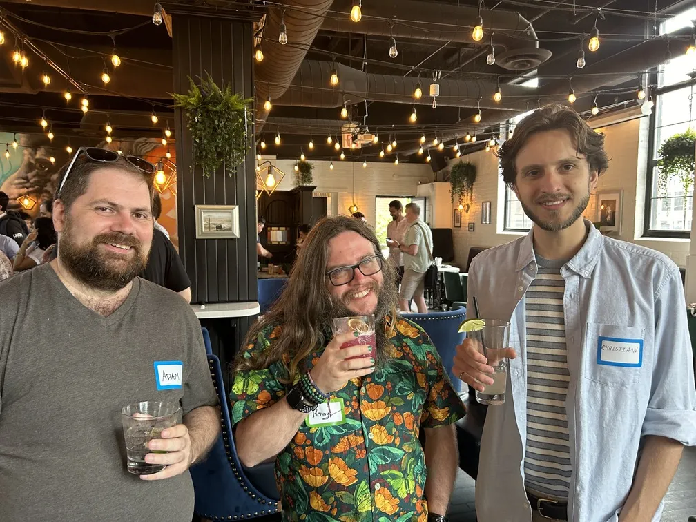 Uken team members enjoying drinks at social event
